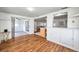 Open living space with hardwood floors and access to a screened in porch area at 3716 Carioca Rd, Holiday, FL 34691