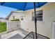 Private outdoor patio with lattice fencing, outdoor seating, and access to the home's back door at 3716 Carioca Rd, Holiday, FL 34691
