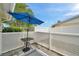 Patio area with umbrella and privacy lattice at 3716 Carioca Rd, Holiday, FL 34691