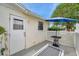 Outdoor patio with seating area and privacy fencing at 3716 Carioca Rd, Holiday, FL 34691