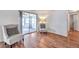 Sunlit porch with laminate floors and large sliding windows offering a bright and airy space to sit in at 3716 Carioca Rd, Holiday, FL 34691