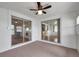 Enclosed sunroom with two sliding glass doors offering views of the home's interior rooms and neutral paint at 3716 Carioca Rd, Holiday, FL 34691