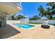 Inviting backyard featuring a sparkling swimming pool with a brick-paved deck and a white storage shed at 3801 Huntington Ne St, St Petersburg, FL 33703