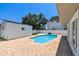 A refreshing swimming pool, lush green lawn, and white storage shed enhance this spacious backyard oasis at 3801 Huntington Ne St, St Petersburg, FL 33703