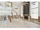Large living room with soaring ceilings, wood-look flooring, and a striking fireplace focal point at 3801 Huntington Ne St, St Petersburg, FL 33703