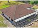 Aerial view of backyard featuring a covered patio and room to landscape at 39427 Comstock Ln, Zephyrhills, FL 33540