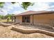View of the backyard showcasing the exterior of the home with room to landscape at 39427 Comstock Ln, Zephyrhills, FL 33540