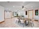 Dining area features tile flooring, neutral paint, and a modern table set at 39427 Comstock Ln, Zephyrhills, FL 33540