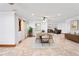 Dining room featuring neutral paint, modern furniture, and access to the living room at 39427 Comstock Ln, Zephyrhills, FL 33540