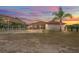 Lovely ranch style home with covered parking and a well maintained yard at sunset at 39427 Comstock Ln, Zephyrhills, FL 33540