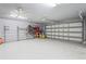 Spacious two car garage complete with high ceilings and a fan to keep cool at 39427 Comstock Ln, Zephyrhills, FL 33540