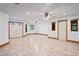Large and bright living room with tiled floors and double entry doors at 39427 Comstock Ln, Zephyrhills, FL 33540