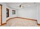 Unfurnished living room offering tiled floors, neutral paint, and a ceiling fan at 39427 Comstock Ln, Zephyrhills, FL 33540