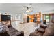 Spacious open concept living area showcasing kitchen, breakfast bar, living room with cozy seating at 39427 Comstock Ln, Zephyrhills, FL 33540