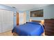 Bright bedroom with wood floors, closet, and window at 4027 Alabama Ne Ave, St Petersburg, FL 33703