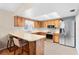 Well-lit kitchen featuring wooden cabinets and stainless steel appliances at 4027 Alabama Ne Ave, St Petersburg, FL 33703