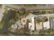 Aerial view showcasing property lot lines, landscaping, and proximity to water at 4872 Silverthorne Ct, Oldsmar, FL 34677