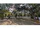 Expansive backyard featuring privacy fencing and mature trees at 4872 Silverthorne Ct, Oldsmar, FL 34677