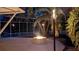 Backyard view at dusk showing the in-ground pool, spa, and outdoor fire pit, perfect for evening relaxation and entertainment at 4872 Silverthorne Ct, Oldsmar, FL 34677