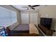 Bedroom with a ceiling fan, modern style platform bed, two closets, and a window at 4872 Silverthorne Ct, Oldsmar, FL 34677