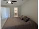 Comfortable bedroom with ceiling fan and large closet at 4872 Silverthorne Ct, Oldsmar, FL 34677