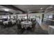 Spacious dining room with scenic views, neutral decor, and seating for large gatherings at 4872 Silverthorne Ct, Oldsmar, FL 34677