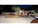 Stately home with a circular driveway, lush landscaping, and a well-maintained three-car garage at 4872 Silverthorne Ct, Oldsmar, FL 34677