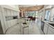 Open kitchen featuring dual islands, stainless appliances, granite countertops, and seamless flow to living area at 4872 Silverthorne Ct, Oldsmar, FL 34677
