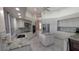 White kitchen with stone countertops, stainless steel appliances, and recessed lighting at 4872 Silverthorne Ct, Oldsmar, FL 34677