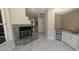 Open living room with tile floors, a fireplace, a wet bar, and bright windows providing lots of light at 4872 Silverthorne Ct, Oldsmar, FL 34677