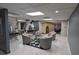Comfortable lounge area with stylish seating, vanity, and locker room in neutral colors at 4872 Silverthorne Ct, Oldsmar, FL 34677