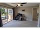 Bright office space equipped with desk and a sliding glass door at 4872 Silverthorne Ct, Oldsmar, FL 34677