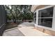 Enjoy this outdoor patio, perfect for entertaining with views of mature trees at 4872 Silverthorne Ct, Oldsmar, FL 34677