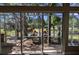 Enjoy serene views from the screened lanai, overlooking a pond and beautifully landscaped greenery at 4872 Silverthorne Ct, Oldsmar, FL 34677