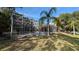 Screened in pool area with lovely landscaping and a gorgeous blue pool at 4872 Silverthorne Ct, Oldsmar, FL 34677