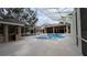 Enclosed pool area featuring a spa, poolside cabana and plenty of patio space at 4872 Silverthorne Ct, Oldsmar, FL 34677