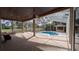 Spacious screened patio with view of a pool, bar, and backyard at 4872 Silverthorne Ct, Oldsmar, FL 34677