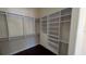 Walk-in closet with custom shelving and drawers provide ample storage space at 4872 Silverthorne Ct, Oldsmar, FL 34677