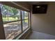 A scenic view from a window overlooking lush greenery and a peaceful pond, bringing nature indoors at 4872 Silverthorne Ct, Oldsmar, FL 34677