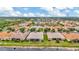 Aerial view of a community featuring several homes with water views and mature landscaping at 4949 Marble Springs Cir, Wimauma, FL 33598