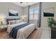 Bright bedroom with shuttered window, a ceiling fan, and an area rug at 4949 Marble Springs Cir, Wimauma, FL 33598