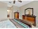 Lovely bedroom featuring a ceiling fan, natural light, and and dressers at 4949 Marble Springs Cir, Wimauma, FL 33598