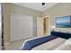Bedroom featuring a storage closet, a ceiling fan, and a TV set at 4949 Marble Springs Cir, Wimauma, FL 33598
