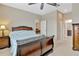 Inviting bedroom featuring ceiling fan and views to other rooms at 4949 Marble Springs Cir, Wimauma, FL 33598