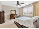 Bright bedroom with a ceiling fan, ample natural light, and stylish furnishings at 4949 Marble Springs Cir, Wimauma, FL 33598