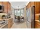 Cozy breakfast nook with stainless steel appliances, bright windows, and elegant pendant lighting at 4949 Marble Springs Cir, Wimauma, FL 33598