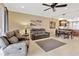 Comfortable living room featuring tile floors, neutral walls, and a ceiling fan for added comfort at 4949 Marble Springs Cir, Wimauma, FL 33598