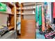 Organized walk-in closet featuring custom shelving and plenty of storage space at 4949 Marble Springs Cir, Wimauma, FL 33598