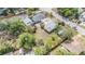 Aerial view of a home with a two-car garage, partial fencing, and adjacent pink house at 5101 13Th S Ave, Gulfport, FL 33707