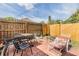 Outdoor patio featuring a table with chairs and a separate seating area surrounded by a wood fence at 5101 13Th S Ave, Gulfport, FL 33707